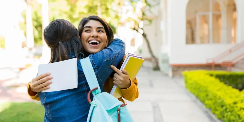 Hispanic woman celebrating getting into college