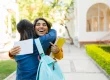 Hispanic woman celebrating getting into college