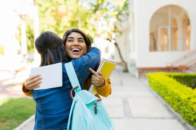 Hispanic woman celebrating getting into college